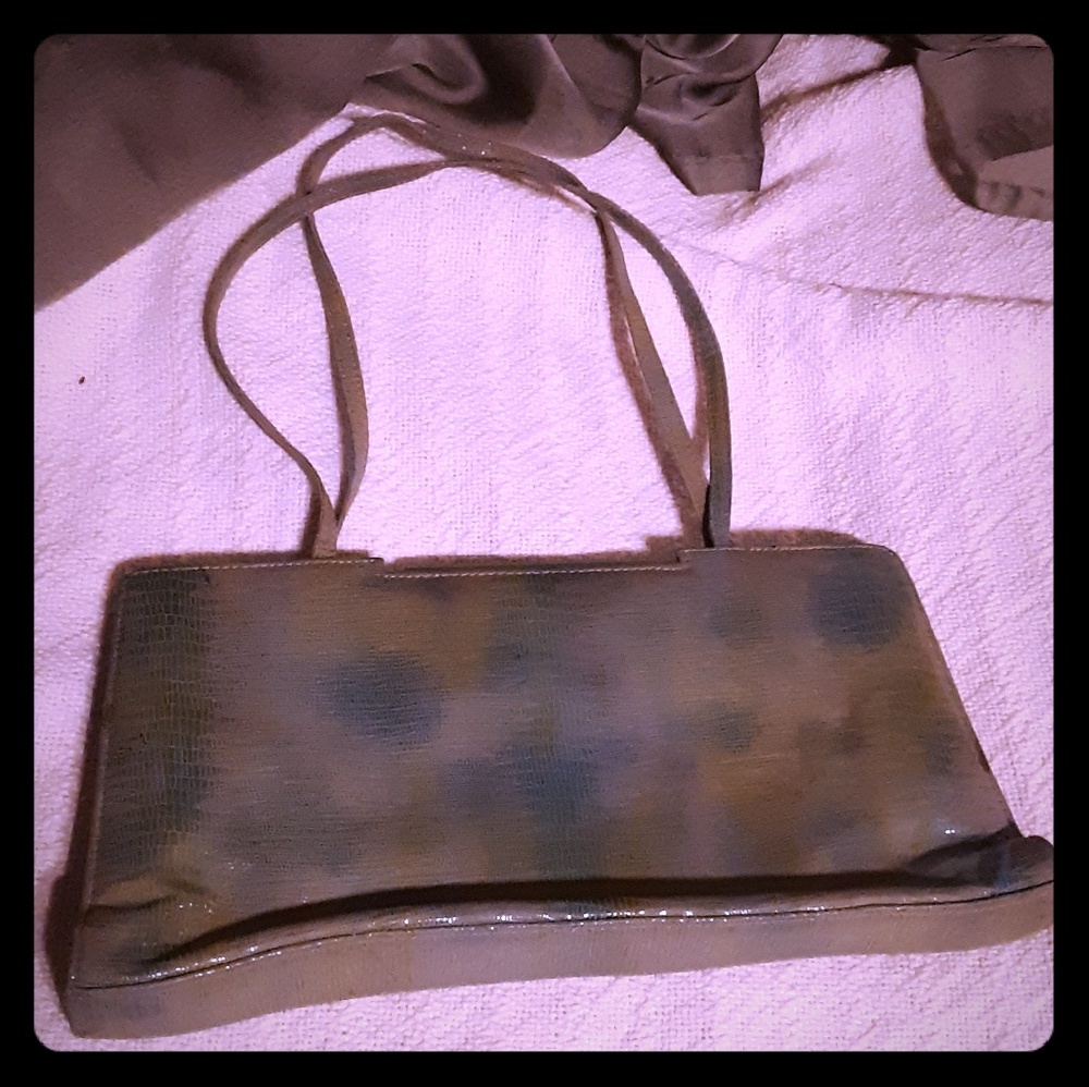 2 purses. The Kenneth cole is the olive purse....